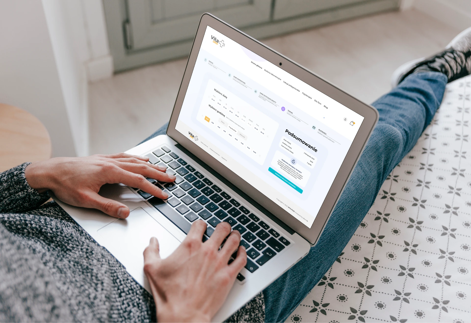 person with a laptop on his laps with open application